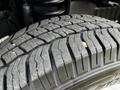 Close-up of a tire tread on a 2016 Ford Econoline showing detailed patterns and grooves designed for traction and grip