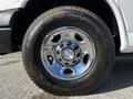 A close-up view of a chrome wheel rim featuring a Chevrolet logo and a Blizzak tire mounted on it