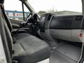 Interior view of a 2017 Mercedes-Benz Sprinter featuring a driver's seat, steering wheel, and dashboard with controls and display