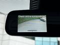 A 2020 Mercedes-Benz Sprinter is displayed on a rearview mirror camera screen with a message to check entire surroundings