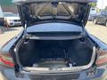 The trunk of a 2019 Dodge Charger opened to reveal a spacious interior with no items inside and a flat surface