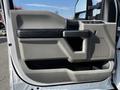 2021 Ford F-550 door panel featuring gray plastic with black accents and a textured grip handle