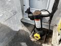 A vehicle jack designed for a 2009 Ford Econoline with a sturdy base and a manual pump lever beside instructional labels