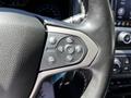 Steering wheel controls of a 2021 Chevrolet Colorado featuring buttons for audio navigation and cruise control