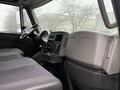 Interior view of a 2014 International TerraStar showing the driver's seat dashboard and controls