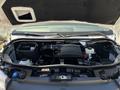 Under the hood of a 2019 Mercedes-Benz Sprinter showing the engine compartment with various components including the air intake and fluid reservoirs