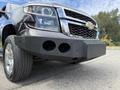 A 2017 Chevrolet Tahoe with a black modified front bumper featuring three circular openings and chrome accents on the grille and headlights