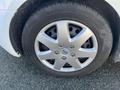Silver alloy wheel of a 2017 Ford Transit Connect with six spokes and a black tire