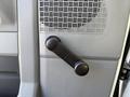 The image shows the manual window crank handle of a 2012 Ford Econoline E-450
