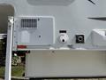 A 2018 Westland Travelaire features a white exterior with utility compartments and access points including an air vent water connection and power input