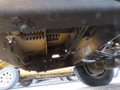 The undercarriage of a 2015 Vermeer Corporation BC1200XL showcasing its components including springs and cables