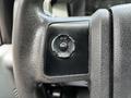 Image shows the steering wheel of a 2016 Ford F-550 with a control panel featuring buttons labeled SETUP INFO and RESET