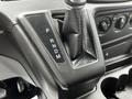 Gear shifter of a 2017 Ford Transit 350 with positions marked as P R N D M and textured surface