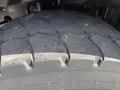 Close-up of a worn tire tread from a 2005 Volvo VND showing deep grooves and uneven wear