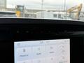 Dashboard display of a 2021 Ford F-150 showing the time and temperature along with various control icons for phone list sound vehicle and clock