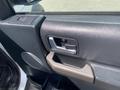 Interior door handle and controls of a 2006 Land Rover LR3