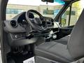 Interior view of a 2020 Mercedes-Benz Sprinter showing the dashboard steering wheel and front seating area