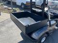 A 2017 Yamaha Golf Cart G29 E with an open black cargo bed in the rear area