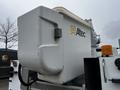 A white Altec bucket on a 2013 International DuraStar utility truck equipped for aerial work