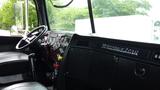 Interior view of a 2019 Western Star Trucks 4900 featuring a steering wheel and dashboard with various dials and controls