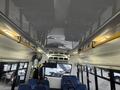 Interior view of a 2017 Chevrolet Express with visible seating and ceiling lights