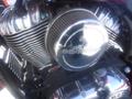 Close-up of a 2017 Indian Chieftain Elite motorcycle engine featuring a chrome air filter and polished metal components