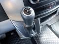 The image features the gear shift of a 2016 Mercedes-Benz Sprinter with a black leather grip and a silver Mercedes-Benz emblem on top