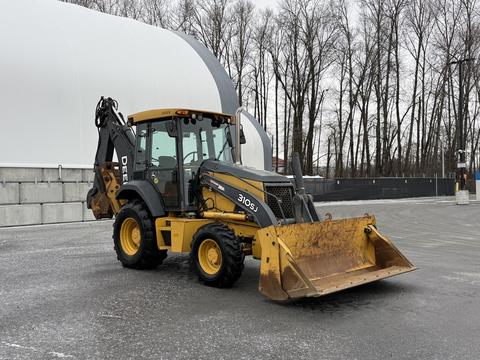 A 2011 John Deere 310SJ 4x4 Wheel Loader with an extended hoe and a 4 in 1 bucket is positioned in the foreground