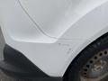 A white 2017 Ford Transit Connect showing a dent and scratches on the rear passenger side panel with a portion of the tire visible