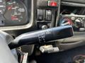 A close-up of the windshield wiper control stalk in a 2009 Ford LCF 550 showing various settings including mist and intervals