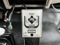 Control panel of a Western snow plow with a lever labeled for raising lowering and adjusting the plow direction