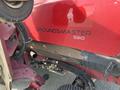A red 2014 Toro Groundmaster 5910 with visible mechanical parts and the word "GROUNDSMAGTER" along the side