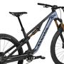A 2025 Canyon Neuron CF 9 mountain bike featuring a sleek blue and black frame with gold suspension components and a reliable drivetrain system