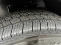 Close-up of a tire tread from a 2019 Mercedes-Benz Sprinter showcasing detailed patterns and grooves designed for traction and grip