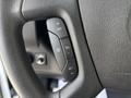 Steering wheel controls of a 2020 Chevrolet Express featuring buttons for cruise control settings and other functions