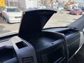 Interior view of a 2016 Mercedes-Benz Sprinter dashboard showing the open storage compartment and control panel with buttons and a display screen