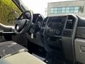 Interior view of a 2017 Ford F-250 SD showcasing the steering wheel dashboard and control panel with various dials and buttons