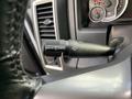 A close-up view of the windshield wiper control lever in a 2021 RAM 1500 featuring various settings including mist and wash options