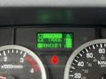 Dashboard display of a 2022 Isuzu NPR showing the hour meter reading 1764.6 hours speedometer and gear indicators