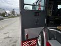 A 2009 Spartan Gladiator fire truck's side door with a textured finish and red and silver reflective paneling