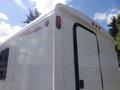 2004 Royal 18 Foot Office Trailer with a white exterior featuring a door and red lights on the top edge