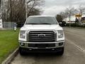 A white 2017 Ford F-150 pickup truck facing forward with a prominent grille and clear headlights