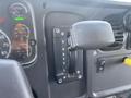 Interior view of a 2017 Freightliner M2 106 showing gear shift lever with options for reverse neutral drive and gears 2 and 1