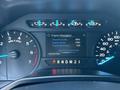 Dashboard of a 2015 Ford F-150 showing engine information including oil life percentage engine hours and odometer reading