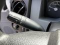 Close-up of the turn signal lever on the steering column of a 2016 Ford F-550