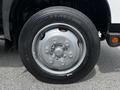 A close-up view of a silver wheel of a 2018 Hino 195 with a black tire featuring the brand name Aeolus embossed on the sidewall