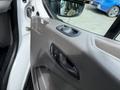 Interior door handle and controls of a 2021 Ford Transit with a focus on the window and door lock buttons