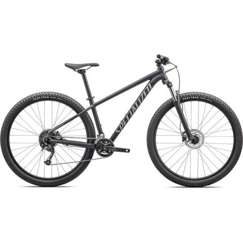 2025 Specialized Rockhopper Mountain Bike featuring a matte black frame wide tires and front suspension designed for off-road terrain