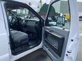 Interior of a 2015 Ford F-550 showing the driver's seat dashboard and door panel