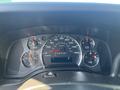 Dashboard of a 2012 Chevrolet Express displaying speedometer fuel gauge and other indicators